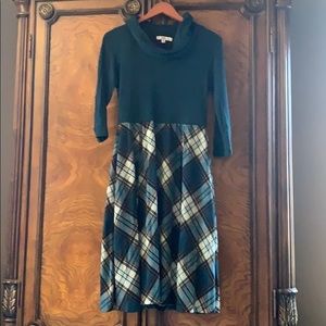 Cowl neck hunter green with plaid skirt.
